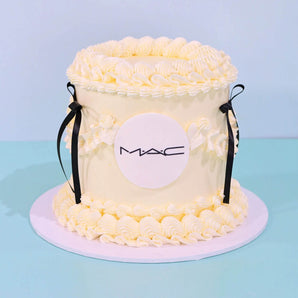 Corporate Vintage Cake with Logo - Single Colour with cream icing, black ribbons, and an edible MAC logo plaque.